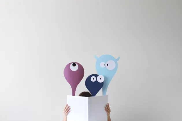 Person and monster hiding behind a white sheet of paper. Illustration