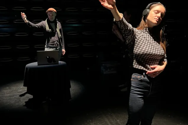 Two persons in an audio space room. Photo.