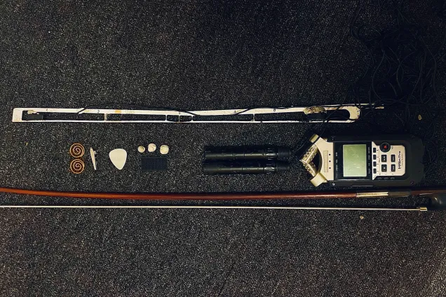 Cello bow equipped with sensors. Photo.