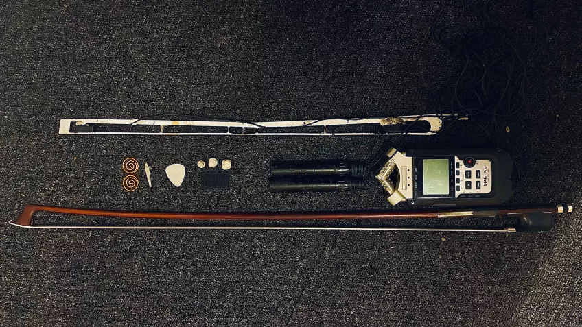 Cello bow equipped with sensors. Photo.